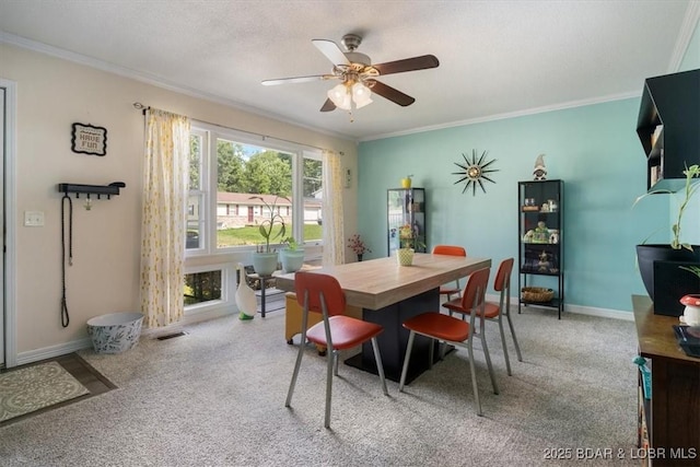 901 Larkin Dr, Eldon, MO 65026 - carpeted dining space featuring ceiling fan and ornamental molding