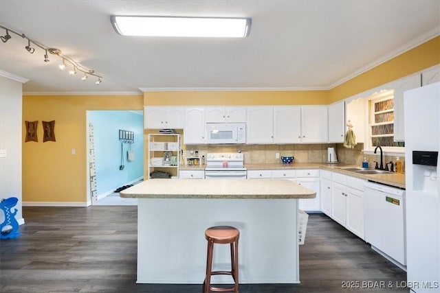 901 Larkin Dr, Eldon, MO 65026 - kitchen featuring white appliances, ornamental molding, a center island, white cabinetry, and light countertops