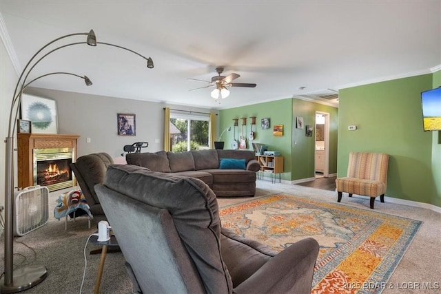 901 Larkin Dr, Eldon, MO 65026 - carpeted living area with ornamental molding, a glass covered fireplace, and ceiling fan