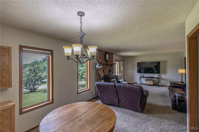 278 Panoramic Dr, Camdenton, MO 65020 - carpeted dining space with a chandelier and a textured ceiling