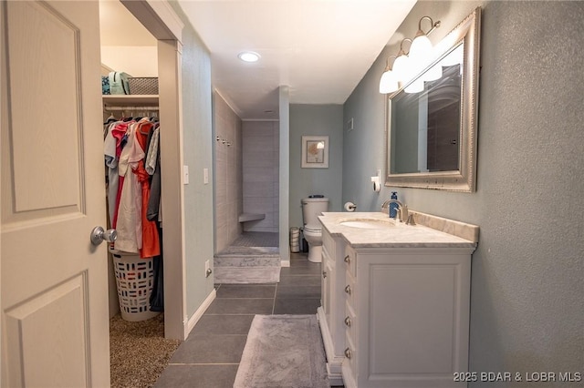 278 Panoramic Dr, Camdenton, MO 65020 - bathroom with vanity, tile patterned floors, tiled shower, and a spacious closet