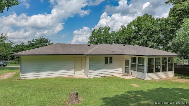 278 Panoramic Dr, Camdenton, MO 65020 - back of property featuring a sunroom, a shingled roof, and a lawn