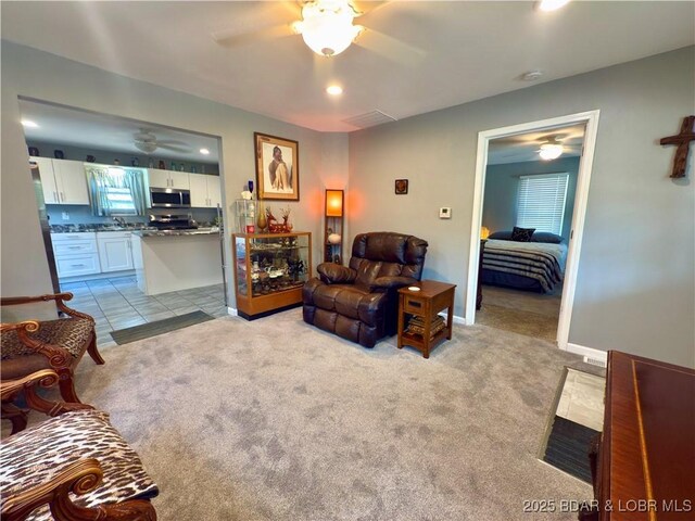 435 Main St, Newburg, MO 65550 - living room with a ceiling fan and light colored carpet
