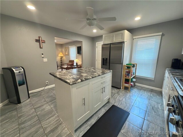 435 Main St, Newburg, MO 65550 - kitchen featuring stainless steel fridge, a ceiling fan, white cabinetry, recessed lighting, and plenty of natural light