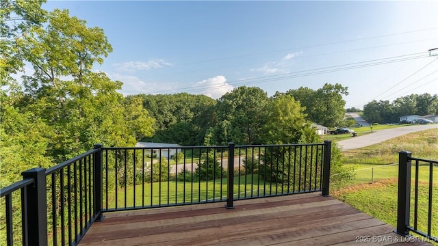 195 Jamie Dr, Camdenton, MO 65020 - wooden deck featuring a lawn