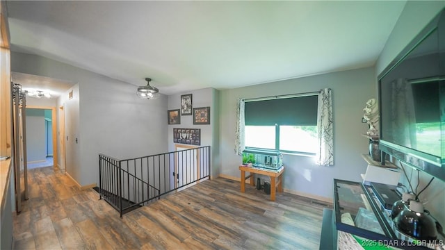 195 Jamie Dr, Camdenton, MO 65020 - hallway with an upstairs landing and wood finished floors