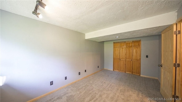 195 Jamie Dr, Camdenton, MO 65020 - unfurnished bedroom with a textured ceiling, carpet floors, and a closet