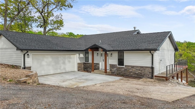 4452 Hamrock Ln, Osage Beach, MO 65065 - modern farmhouse with a shingled roof, driveway, a garage, and stone siding