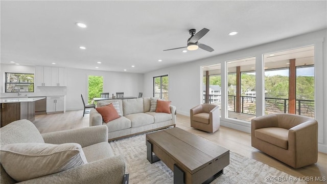 4452 Hamrock Ln, Osage Beach, MO 65065 - living area featuring recessed lighting, light wood-type flooring, and a ceiling fan