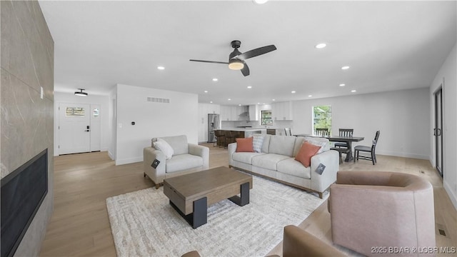 4452 Hamrock Ln, Osage Beach, MO 65065 - living room with light wood-style floors, recessed lighting, and ceiling fan