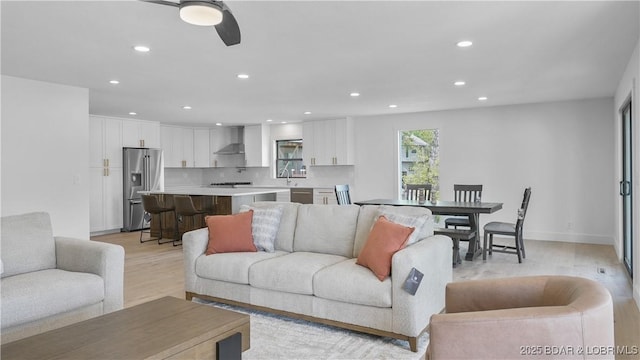 4452 Hamrock Ln, Osage Beach, MO 65065 - living area with light wood-type flooring, recessed lighting, and a ceiling fan