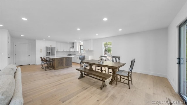 4452 Hamrock Ln, Osage Beach, MO 65065 - dining room featuring light wood-style flooring and recessed lighting