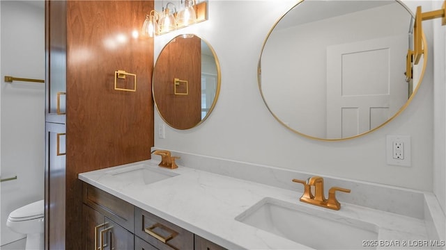 4452 Hamrock Ln, Osage Beach, MO 65065 - bathroom with double vanity and toilet