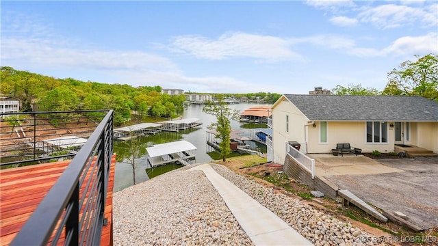 4452 Hamrock Ln, Osage Beach, MO 65065 - water view featuring a dock and boat lift