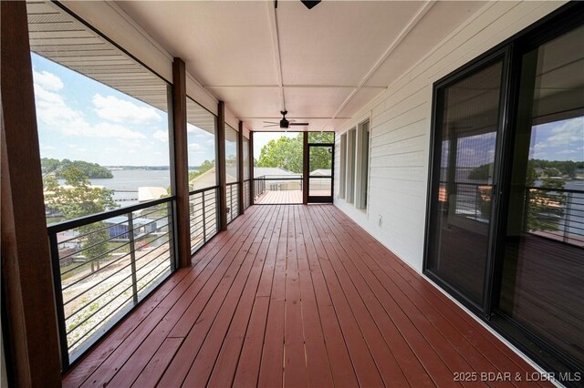 4452 Hamrock Ln, Osage Beach, MO 65065 - deck with a water view and ceiling fan