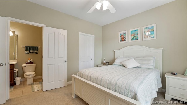 4499 Ski Dr Unit 346, Osage Beach, MO 65065 - bedroom featuring light carpet, ensuite bath, and ceiling fan