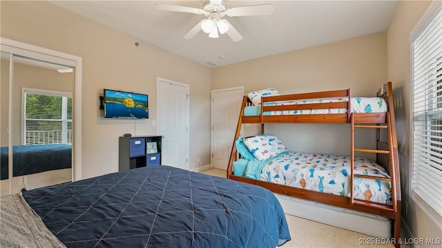 4499 Ski Dr Unit 346, Osage Beach, MO 65065 - carpeted bedroom with multiple windows and ceiling fan