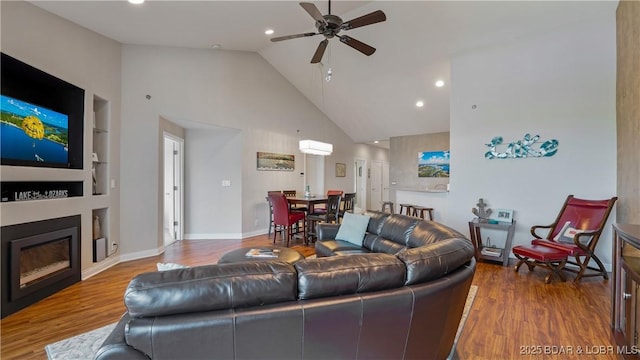 4499 Ski Dr Unit 346, Osage Beach, MO 65065 - living room featuring ceiling fan, wood finished floors, high vaulted ceiling, built in features, and recessed lighting