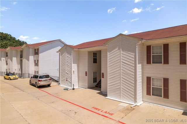 40 Lighthouse Rd Unit 2-301, Lake Ozark, MO 65049 - view of building exterior with uncovered parking