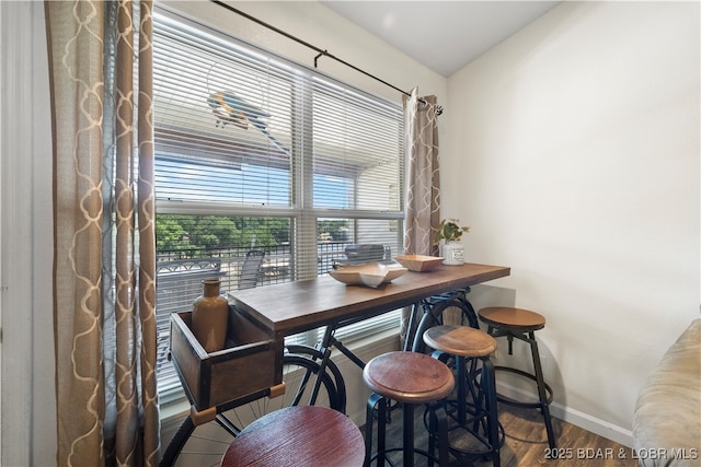 40 Lighthouse Rd Unit 2-301, Lake Ozark, MO 65049 - dining space with baseboards and wood finished floors