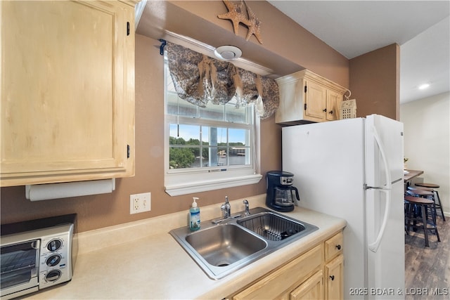 40 Lighthouse Rd Unit 2-301, Lake Ozark, MO 65049 - kitchen featuring freestanding refrigerator, light brown cabinetry, light countertops, and wood finished floors