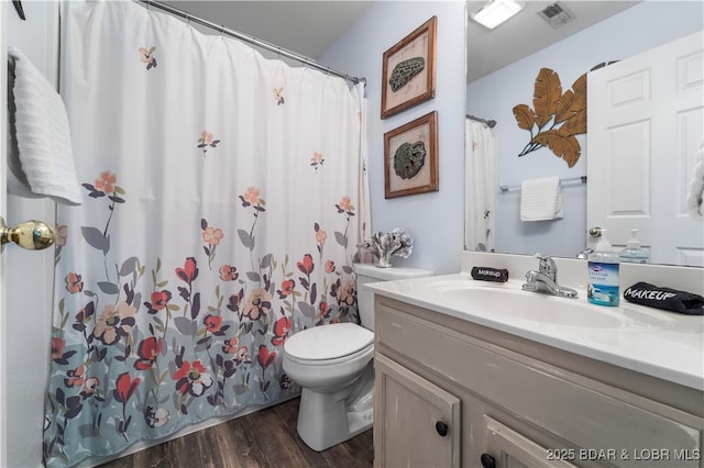 40 Lighthouse Rd Unit 2-301, Lake Ozark, MO 65049 - bathroom featuring vanity, wood finished floors, and curtained shower