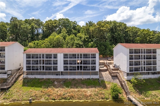 40 Lighthouse Rd Unit 2-301, Lake Ozark, MO 65049 - view of building exterior featuring stairs and a water view