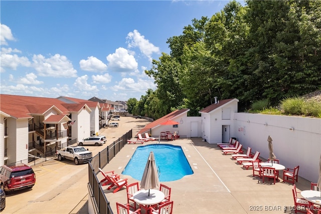 40 Lighthouse Rd Unit 2-301, Lake Ozark, MO 65049 - community pool with a patio area and a residential view