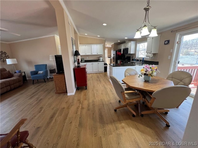 965 Four Waters Dr, Sunrise Beach, MO 65079 - dining room with plenty of natural light, ornamental molding, light wood-style flooring, and recessed lighting