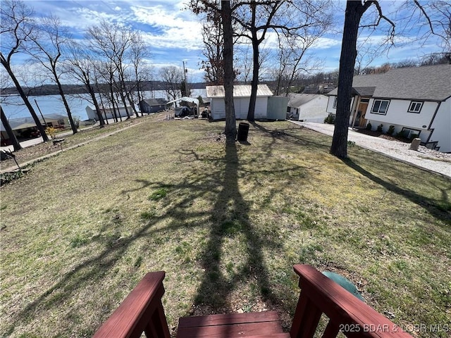965 Four Waters Dr, Sunrise Beach, MO 65079 - view of grassy yard with a water view and a residential view