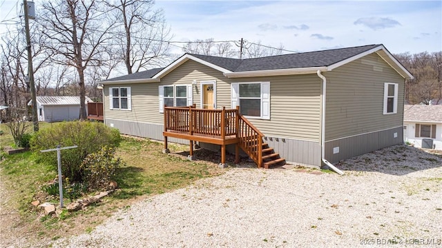 965 Four Waters Dr, Sunrise Beach, MO 65079 - manufactured / mobile home featuring a shingled roof