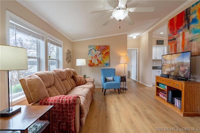 965 Four Waters Dr, Sunrise Beach, MO 65079 - living room with ornamental molding, plenty of natural light, light wood-type flooring, and ceiling fan