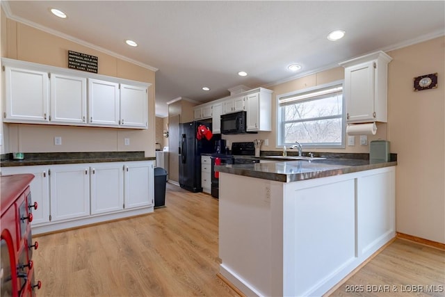 965 Four Waters Dr, Sunrise Beach, MO 65079 - kitchen with crown molding, black appliances, light wood finished floors, white cabinetry, and a peninsula