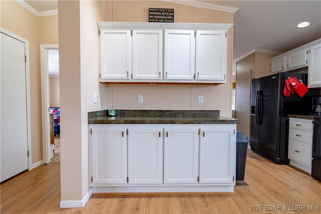 965 Four Waters Dr, Sunrise Beach, MO 65079 - kitchen with black refrigerator with ice dispenser, light wood-style floors, crown molding, white cabinets, and dark stone countertops