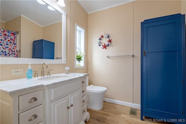965 Four Waters Dr, Sunrise Beach, MO 65079 - full bath featuring wood finished floors, vanity, and crown molding