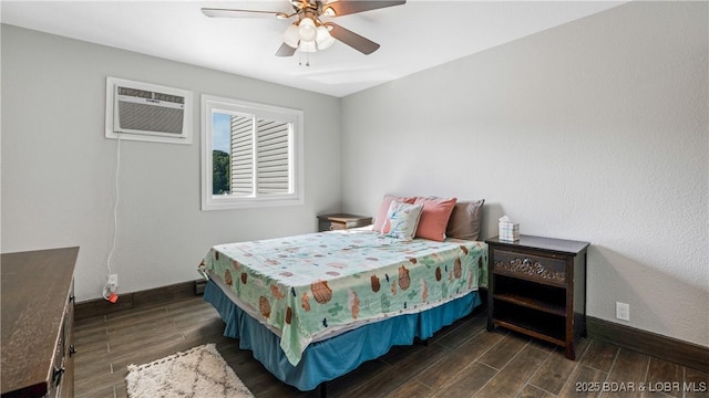 37 Hampton Bay Rd Unit 6, Eldon, MO 65026 - bedroom featuring dark wood finished floors, a wall mounted AC, and a ceiling fan