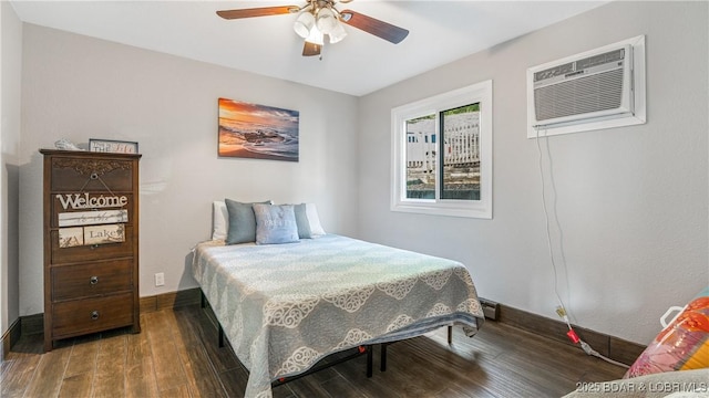 37 Hampton Bay Rd Unit 6, Eldon, MO 65026 - bedroom with wood finished floors, a wall mounted AC, and ceiling fan