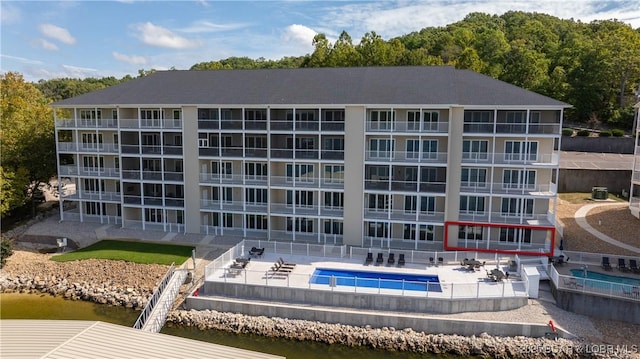 104 Sierra Bay Dr Unit 1A, Camdenton, MO 65020 - view of apartment building / complex with a community pool and a water view