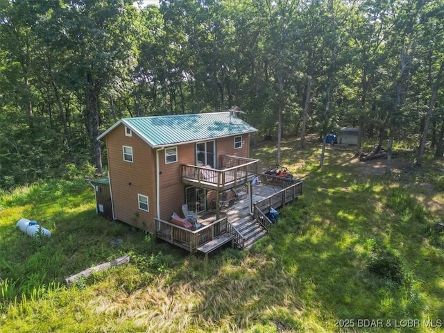32655 Challenge Dr, Lincoln, MO 65338 - rear view of house featuring a deck and a metal roof