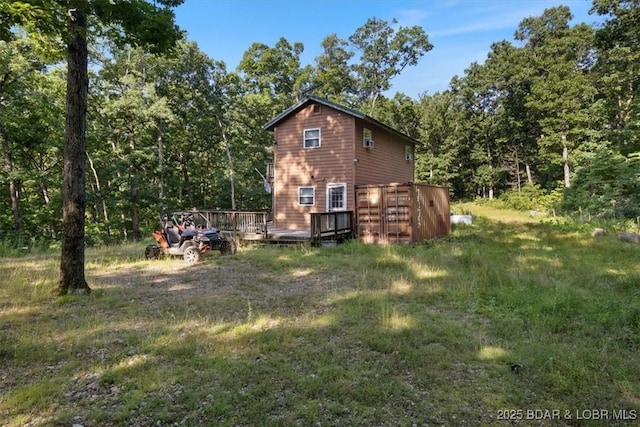 32655 Challenge Dr, Lincoln, MO 65338 - view of property exterior with a wooden deck and a forest view