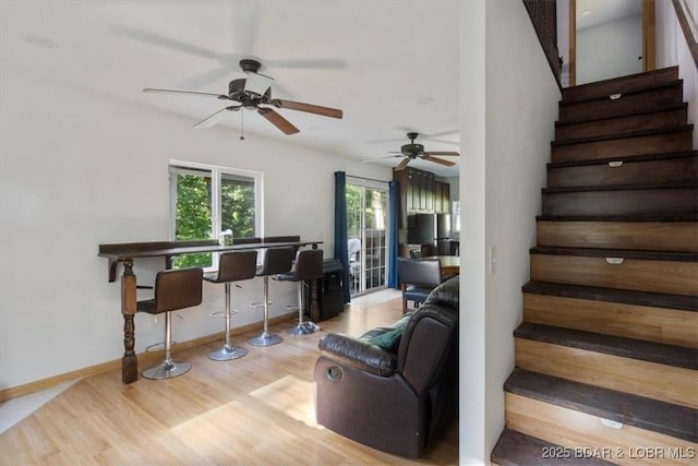 32655 Challenge Dr, Lincoln, MO 65338 - living room with stairs, wood finished floors, and a ceiling fan