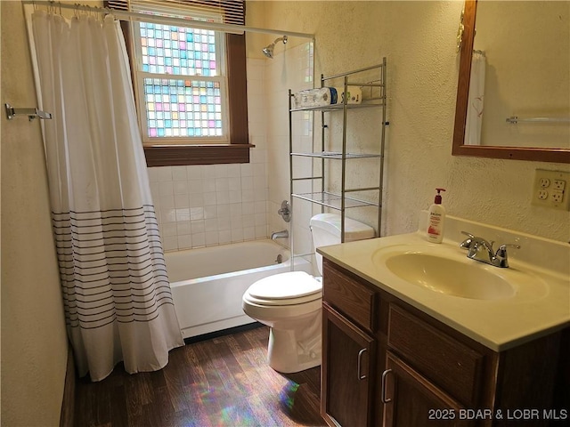 234 W 7th St, Eldon, MO 65026 - full bath featuring a textured wall, wood finished floors, vanity, and shower / bathtub combination with curtain
