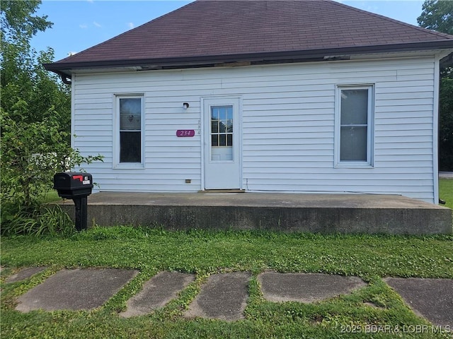 234 W 7th St, Eldon, MO 65026 - rear view of house featuring roof with shingles