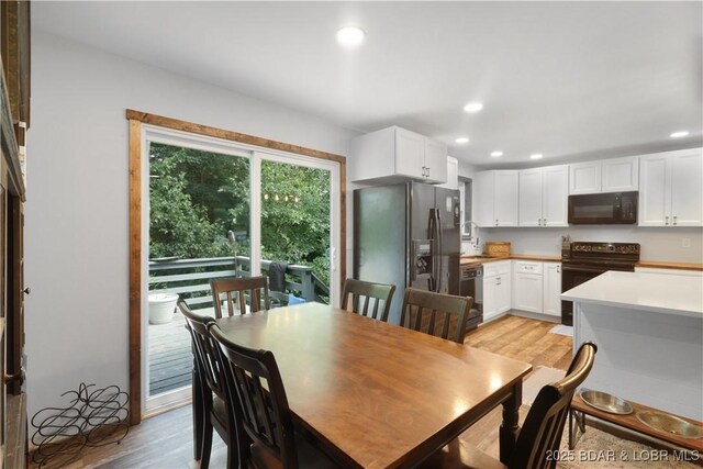 5109 Aqua Dr, Osage Beach, MO 65065 - dining area with light wood-style flooring and recessed lighting