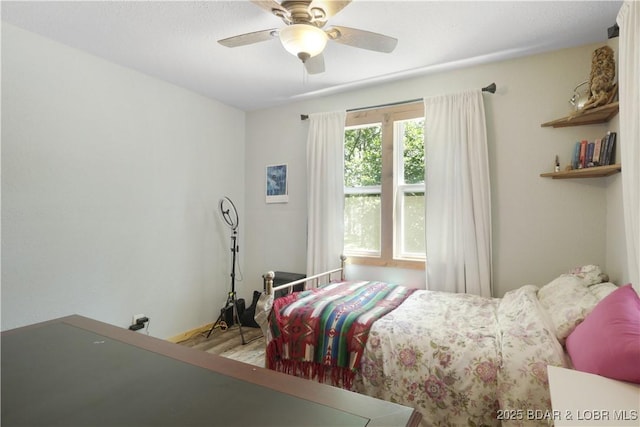 5109 Aqua Dr, Osage Beach, MO 65065 - bedroom featuring a ceiling fan and wood finished floors