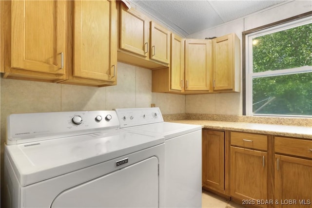 5109 Aqua Dr, Osage Beach, MO 65065 - laundry room with washer and dryer and cabinet space