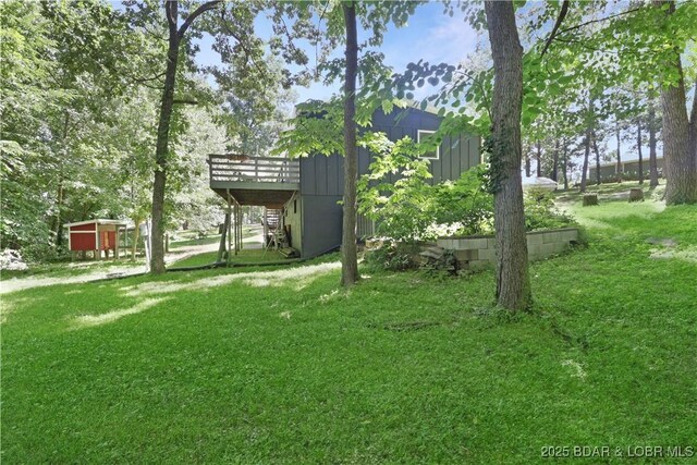 5109 Aqua Dr, Osage Beach, MO 65065 - view of green lawn featuring a deck