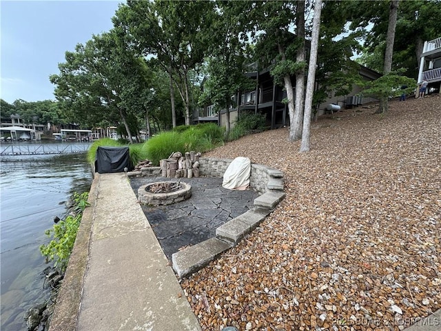 1215 Anemone Rd, Lake Ozark, MO 65049 - dock with an outdoor fire pit and a water view