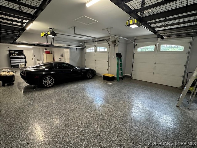 1215 Anemone Rd, Lake Ozark, MO 65049 - garage featuring a garage door opener
