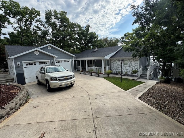 1215 Anemone Rd, Lake Ozark, MO 65049 - ranch-style house featuring covered porch, stone siding, and concrete driveway
